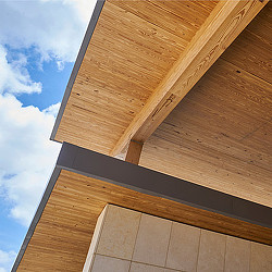 A wooden structure with a blue sky.