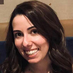 A woman smiling for the camera.