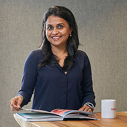 A woman sitting at a table.