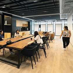 A group of people sitting at tables.